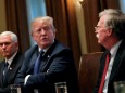 FILE PHOTO: U.S. President Donald Trump receives a briefing from senior military leadership accompanied by Vice President Mike Pence and new National Security Adviser John Bolton in Washington, DC