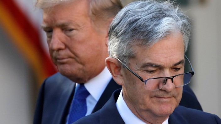FILE PHOTO: U.S. President Donald Trump looks on as Jerome Powell, his nominee to become chairman of the U.S. Federal Reserve moves to the podium at the White House in Washington