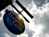 FILE PHOTO: A sign hangs in front of a branch of travel agent Thomas Cook in London
