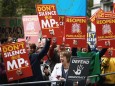 Demonstrators react on the ruling of the Supreme Court during a protest outside the Supreme Court in London