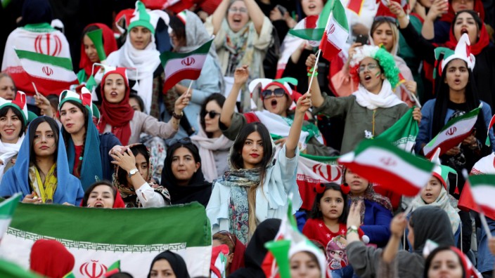 Iranian women attend Iran's World Cup Asian qualifier against Cambodia at the Azadi stadium in Tehran