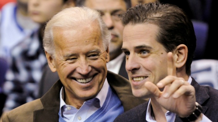 FILE PHOTO: U.S. Vice President Biden and his son Hunter attend an NCAA basketball game between Georgetown University and Duke University in Washington