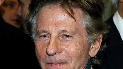 Roman Polanski in Haft: Der polnisch-französische Regisseur Roman Polanski im Jahr 2005 mit der Gloria Artis-Medaille, die er  für seine besonderen Verdienste um die polnische Kunst und Kultur bekommen hat.