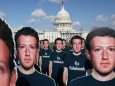 Protesters from Avaaz.org set up dozens of cardboard cut-outs of Facebook CEO Mark Zuckerberg outside of the U.S. Capitol Building in Washington