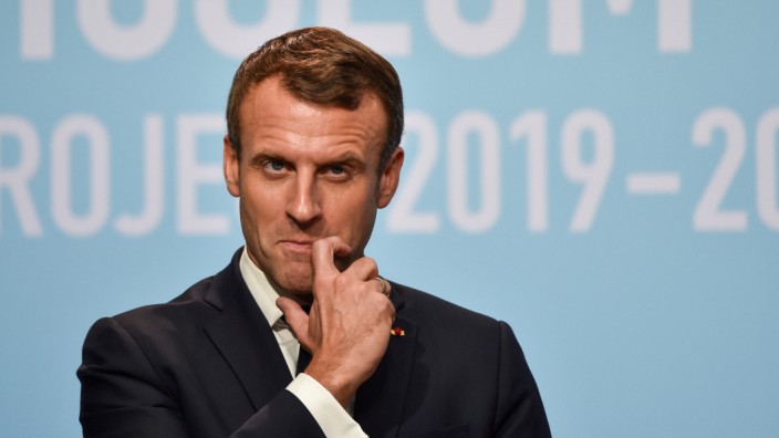FILE PHOTO: French President Emmanuel Macron reacts during the inauguration of Centre Pompidou West Bund Museum in Shanghai