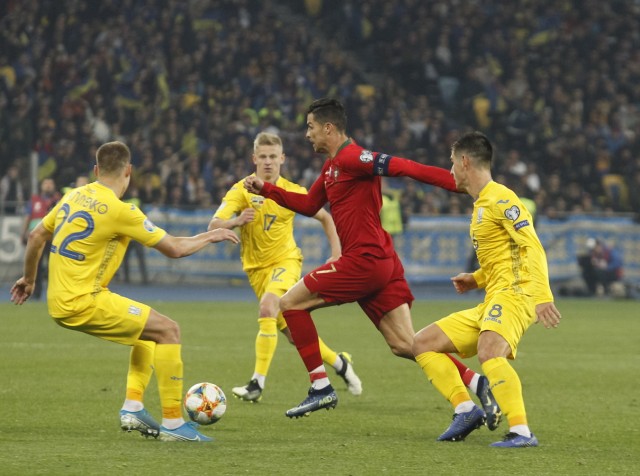 October 14, 2019, Kiev, Ukraine: Cristiano Ronaldo of Portugal national team, Nationalteam (C) and Mykola Matviyenko of; EM Qualifikation Ukraine Portugal