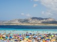 Tourists Enjoying The Turquoise Waters Of Famous Pelosa Beach; Stintino, Sardinia, Italy PUBLICATIONxINxGERxSUIxAUTxONL