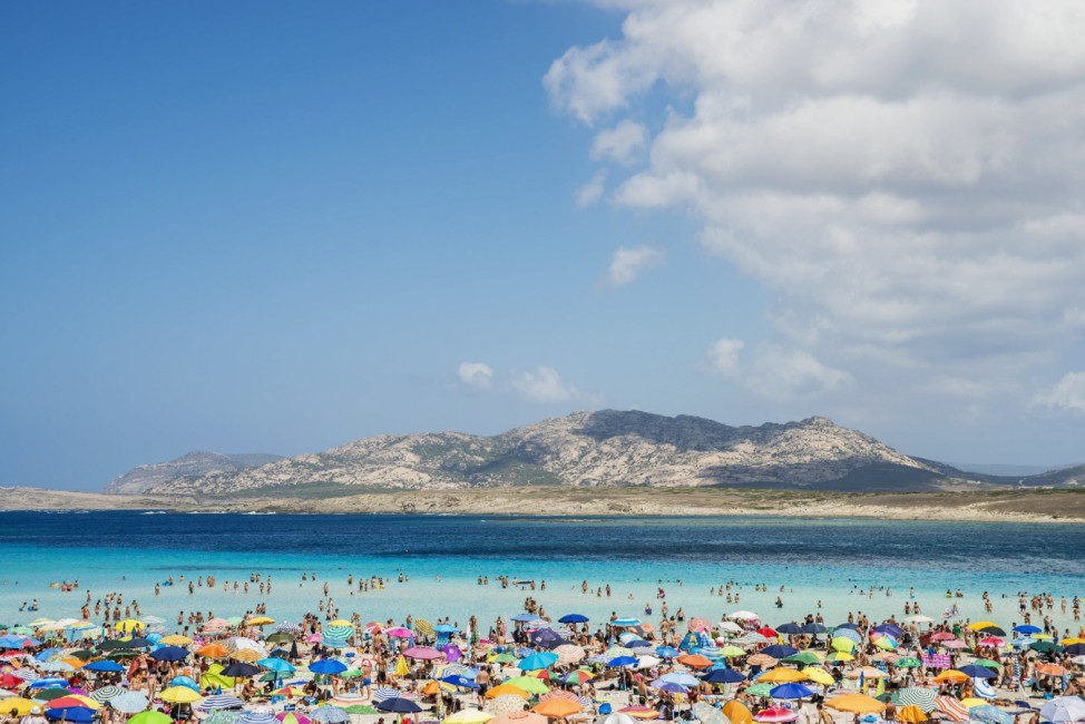 Tourists Enjoying The Turquoise Waters Of Famous Pelosa Beach; Stintino, Sardinia, Italy PUBLICATIONxINxGERxSUIxAUTxONL
