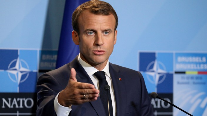 FILE PHOTO: French President Emmanuel Macron addresses a press conference on the second day of the North Atlantic Treaty Organization (NATO) summit in Brussels