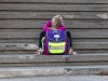 Sad little girl sitting on stairs with school bag model released Symbolfoto PUBLICATIONxINxGERxSUIx