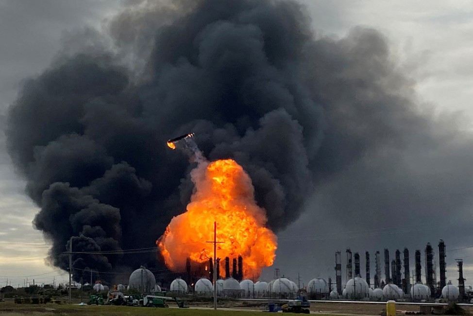 A process tower flies through air after exploding at the TPC Group Petrochemical Plant in Port Neches