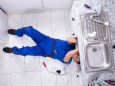Handyman Repairing Sink Pipe model released Symbolfoto PUBLICATIONxINxGERxSUIxAUTxONLY Copyright