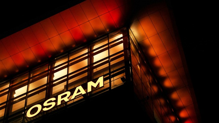 The logo of German lighting manufacturer Osram is illuminated