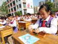 Chinesische Schüler üben Rechnen