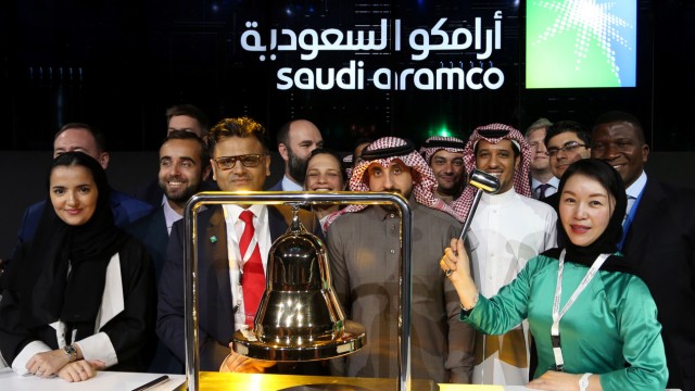 Participants attend the official ceremony marking the debut of Saudi Aramco's IPO on the Riyadh's stock market, in Riyadh