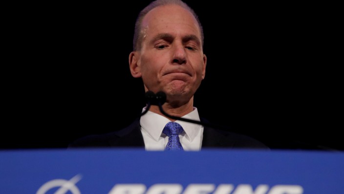 FILE PHOTO: Boeing Co Chief Executive Dennis Muilenburg pauses while speaking during a news conference at the annual shareholder meeting in Chicago