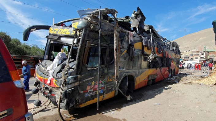 General view shows the wreckage of a passenger bus that collided in Arequipa