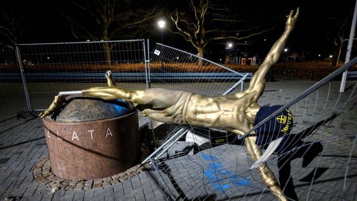 The statue of soccer player Zlatan Ibrahimovic is seen sawn down and destroyed, at the square next to football arena in Malmo