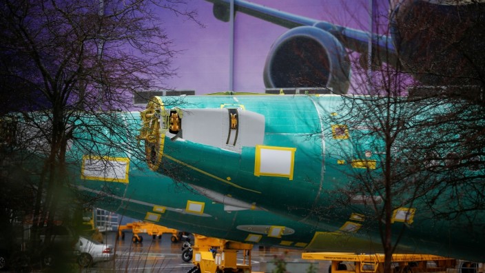 The end of two Boeing 737 Max fuselages are seen parked outside the company's production facility in Renton
