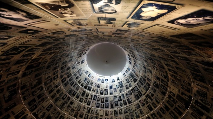 FILE PHOTO: A view from below shows pictures of Jews killed in the Holocaust displayed at the Hall of Names in the Holocaust History Museum at the Yad Vashem World Holocaust Remembrance Center in Jerusalem