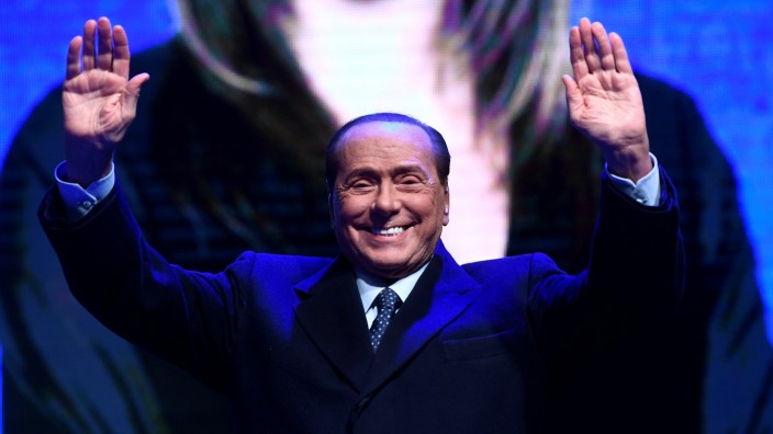 Former Italian Prime Minister and leader of the Forza Italia party Silvio Berlusconi gestures on stage during a rally ahead of a regional election in Emilia-Romagna, in Ravenna