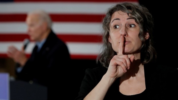 A a sign language interpreter is seen as Democratic 2020 U.S. presidential candidate and former Vice President Joe Biden speaks during a campaign event in Waterloo, Iowa, U.S.