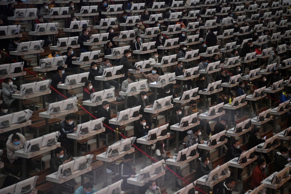 Traders wearing face masks are seen on the trading floor at a flower auction trading centre following an outbreak of the novel coronavirus in the country, in Kunming