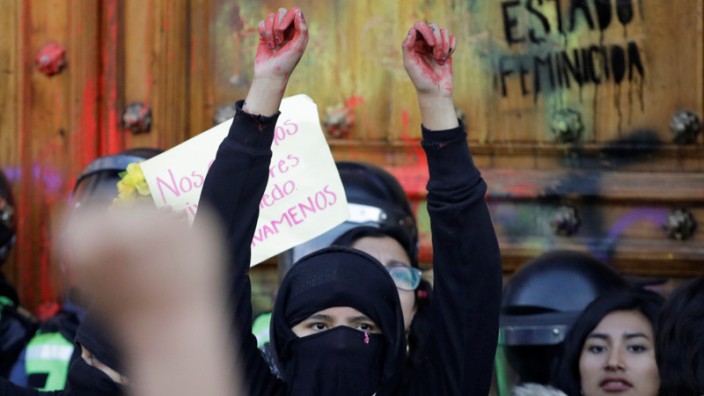 People take part in a protest against gender-based violence in downtown of Mexico City