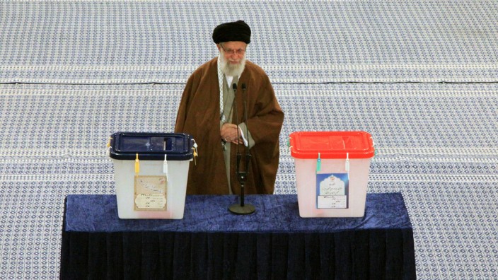 Iran's Supreme Leader Ayatollah Ali Khamenei casts his vote at a polling station during parliamentary elections in Tehran