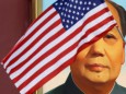 FILE PHOTO: U.S. flag flutters in front of a portrait of late Chinese Chairman Mao at Tiananmen gate during the visit by U.S. President Trump to Beijing