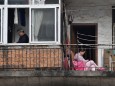 The Wider Image: Life under lockdown: Wuhan's windows, balconies and rooftops