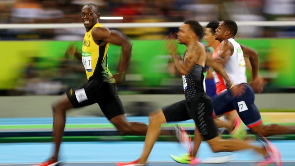 FILE PHOTO: Usain Bolt (JAM) of Jamaica looks at Andre De Grasse (CAN) of Canada as they compete in the 2016 Rio Olympics, Men's 100m Semifinals at the Olympic Stadium in Rio de Janeiro