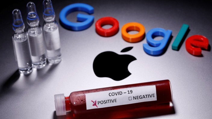 A test tube with fake blood and COVID-19 label and a 3D printed Google logo