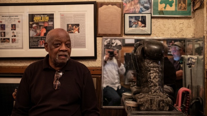 Legendary boxing trainer Jimmy Glenn sits next to memorabilia inside his Times Square bar JimmyâÄÖs Corner in New York