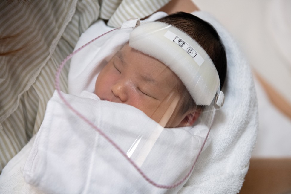 Japanese Clinic Offers Face Visors To Newborns To Protect Against Covid-19