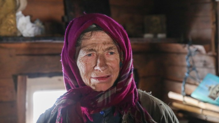 KHAKASSIA, RUSSIA - NOVEMBER 3, 2019: Hermit Agafya Lykova in her house in Khakassia Nature Reserve, south Siberia, Russ