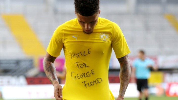 FILE PHOTO: Dortmund's Jadon Sancho celebrates scoring their second goal with a 'Justice for George Floyd' shirt, as play resumes behind closed doors following the outbreak of the coronavirus disease