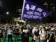 Protesters take part in a candlelight vigil to mark the 31st anniversary of the crackdown of pro-democracy protests at Beijing's Tiananmen Square in 1989, in Hong Kong