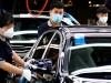FILE PHOTO: Employees wearing face masks work at a plant of Daimler-BAIC joint ventureâÄÖs Beijing Benz Automotive Co during a government organised tour of the facility following the outbreak of the coronavirus disease (COVID-19), in Beijing
