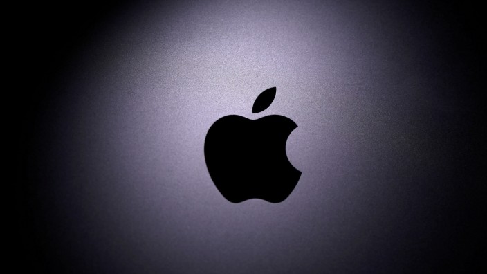 FILE PHOTO: Apple logo is seen on the Macbook in this illustration taken