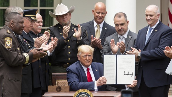 United States President Donald J. Trump displays an Executive Order on Safe Policing for Safe Communities in the Rose G