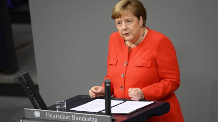 German Chancellor Angela Merkel addresses the lower house of parliament Bundestag, in Berlin