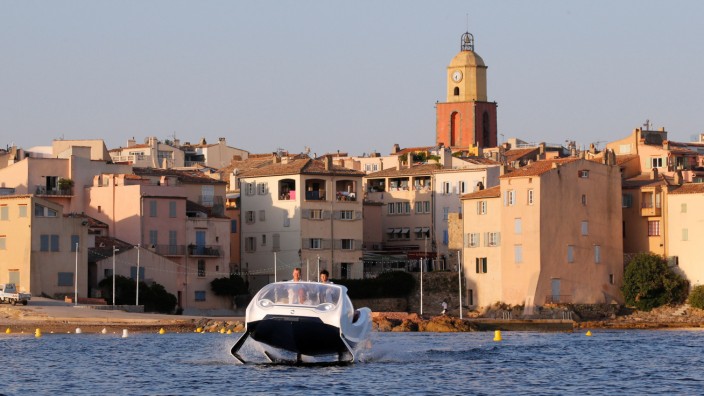 SeaBubbles executives are seen aboard a prototype of their water taxi in the harbour of Saint-Tropez