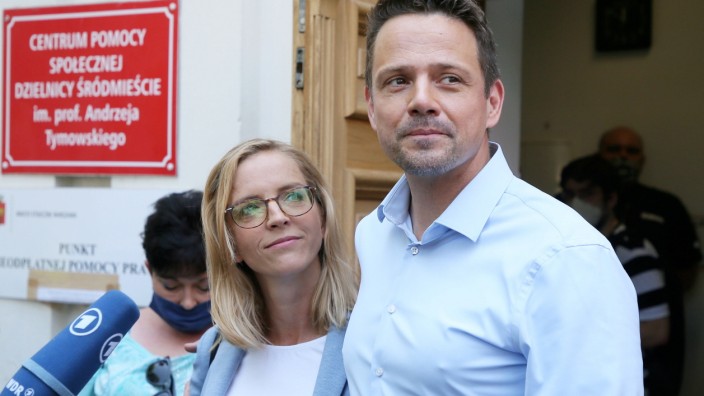 The Civic Coalition presidential candidate Rafal Trzaskowski and his wife Malgorzata Trzaskowska cast their ballots at