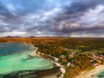 Dramatic sky at dawn over Trou d Eau Douce coastline, aerial view, Flacq district, East coast, Mauritius, Indian Ocean,