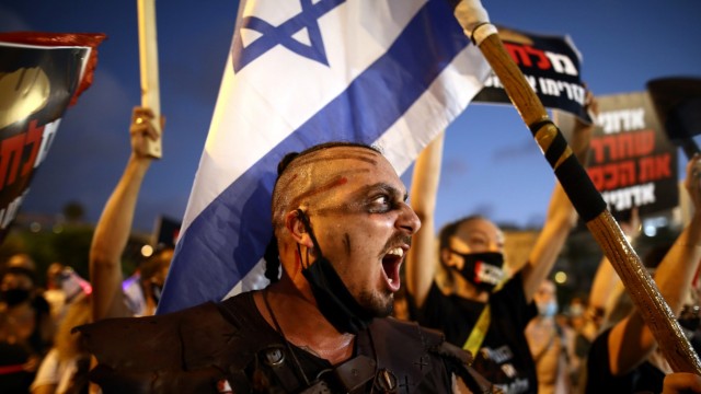 Israelis protest against the government's response to the financial fallout of the coronavirus disease (COVID- 19) crisis at Rabin square in Tel Aviv