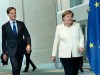 German Chancellor Angela Merkel and Dutch Prime Minister Mark Rutte arrive before speaking to reporters in Berlin