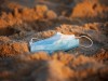 A protective face mask is seen as curbs to fight the spread of coronavirus disease (COVID-19) have been reimposed after a rise in new cases, at Zikim beach in southern Israel