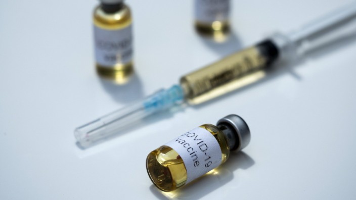 July 23, 2020, Kiev, Ukraine: In this photo illustration the vials labelled COVID-19 vaccine and a syringe seen display