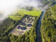 Germany, Bavaria, Wolfratshausen, Drone view of countryside sewage treatment plant LHF00795